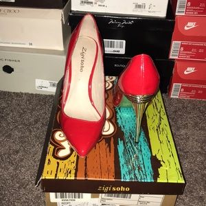Red patent pump with a gold heel